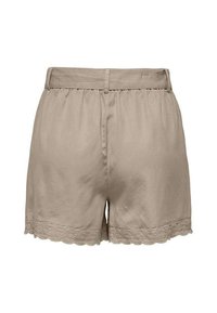 Shorts beige en tissu léger avec une coupe décontractée. Présentent un ourlet en dentelle festonnée et une taille élastique.