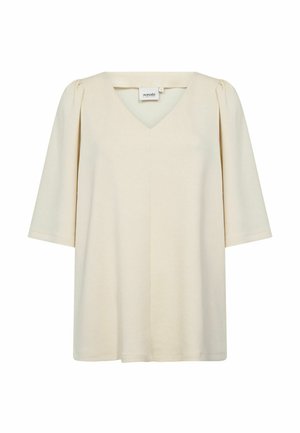 Bluzica kremne barve z V-izrezom, kratkimi rokavi, rahlo nabranimi ramenskimi šivi in ohlapnim krojem, narejena iz mehke, gladke tkanine.
