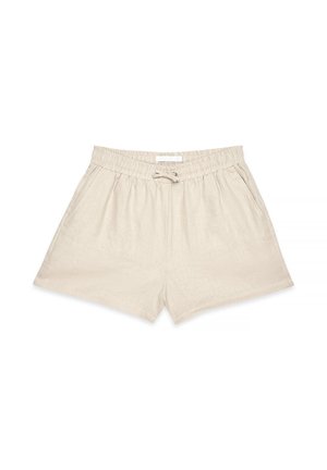 Beige linen shorts with an elastic waistband, drawstring tie, and side pockets. Features a smooth texture and relaxed fit.