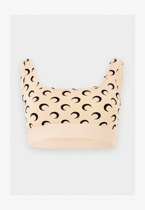 Μπεζ αθλητικό σουτιέν με φαρδιές τιράντες που έχουν επαναλαμβανόμενο μαύρο μοτίβο ημισελήνου και ελαστική ταινία στο κάτω μέρος.