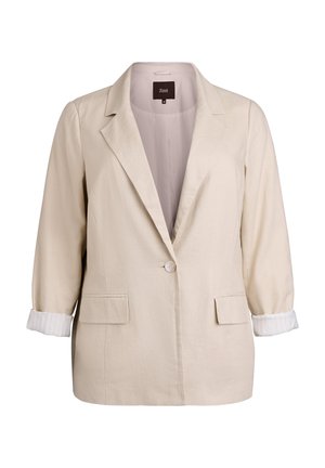 Blazer beige à un bouton, col à revers cranté, deux poches avant à rabat et manches retroussées révélant des poignets intérieurs blancs.