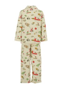 Barnens beige pajamas med färgglada rymd- och julillustrationer, inklusive raketer, utomjordingar, jultomten, renar och planeter.