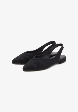 Black slingback shoes with a pointed toe, textured fabric upper, and flat heel. Open sides for breathability and a minimalist design.