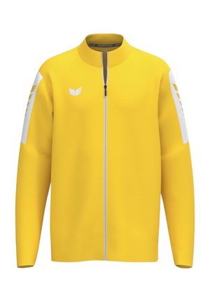 Gelbe Jacke mit durchgehendem Reißverschluss, weißen Streifen an den Ärmeln und weißem Logo auf der Brust, mit rundem Kragen und Frontreißverschluss.