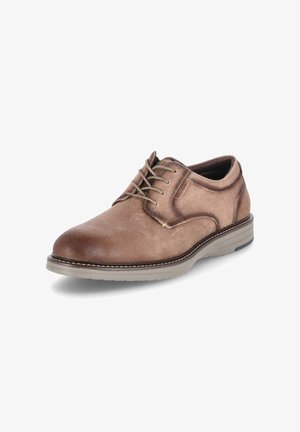 Chaussure habillée pour homme en cuir marron à lacets, semelle beige, bout arrondi et couture visible sur fond blanc.