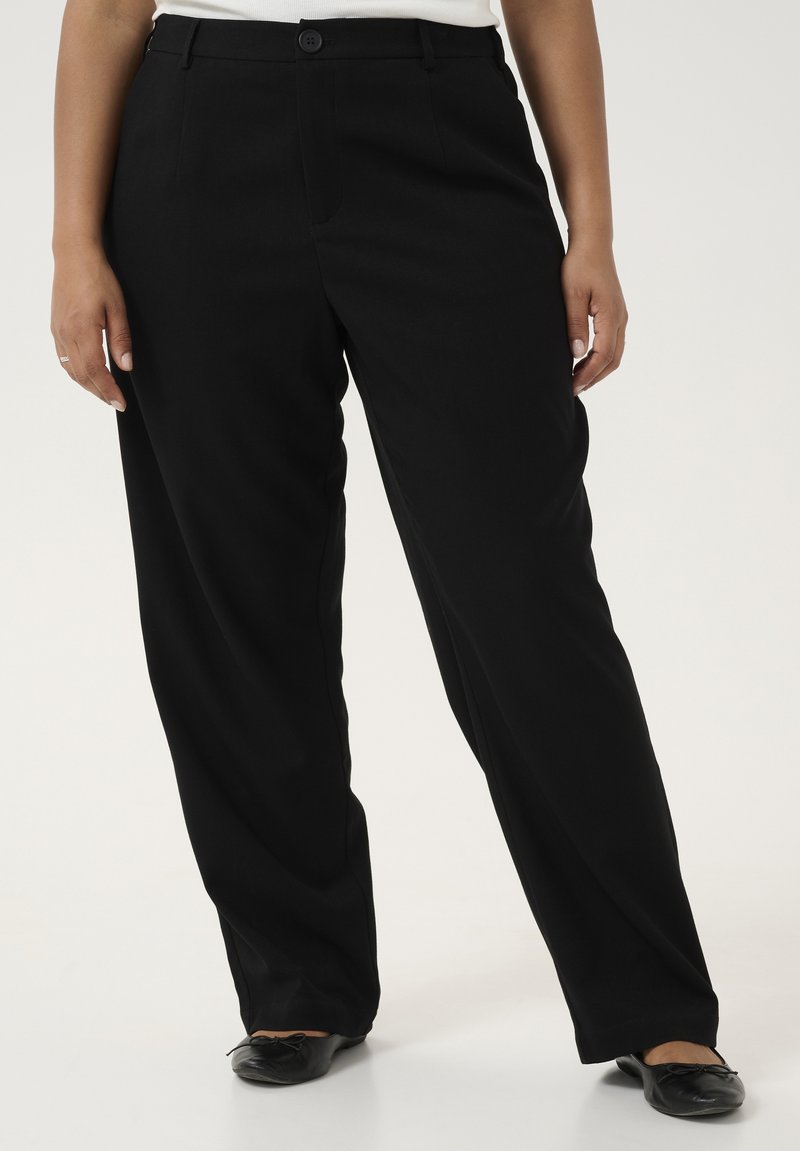 Pantalons noirs en tissu lisse avec une coupe décontractée, dotés d'une fermeture à bouton à l'avant et de poches latérales, avec une jambe droite.