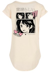 Cream-colored short-sleeve t-shirt featuring a black comic-style print with multiple faces and pink heart accents.