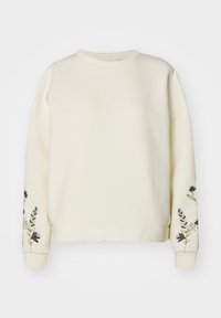 Sudadera de color crema fabricada en un tejido suave, con bordados florales en las mangas y un diseño clásico de escote redondo.