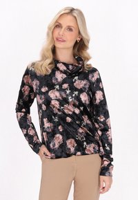 Maglia a collo alto, maniche lunghe, realizzata in morbido tessuto nero con un motivo floreale in tonalità di rosa e verde, caratterizzata da una vestibilità comoda.
