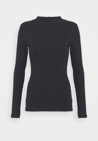 Haut à manches longues côtelé en bleu marine foncé, avec un col montant orné d'un bord à volants et une silhouette ajustée. Texture douce, design minimaliste.