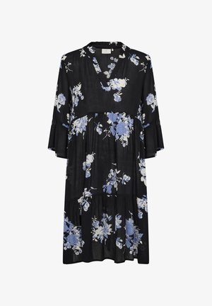 Mustmustel mustriga siniste ja valgete lillemustriga, V-kaelusega, laienevate varrukatega ja kihilise ääre kujundusega. Valmistatud kergest kangast.