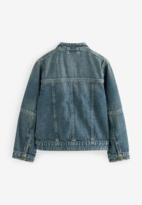 Denim dzseki, világoskék, közepes súlyú, klasszikus szabású, gombos mandzsetták, két hátsó varrás, látható varrás és gallér. Zsebek nem láthatók.