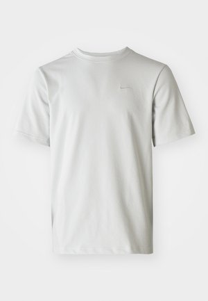 Light gray short-sleeve T-shirt with a textured ribbed pattern and a small logo on the chest. Round neckline, relaxed fit.