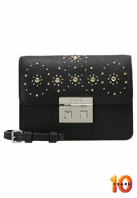 Black synthetic wallet with studded design, gold and crystal accents, and a silver clasp. Features a detachable strap for versatility.