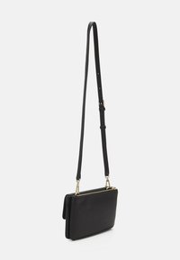 Calvin Klein RE LOCK  - Umhängetasche - black