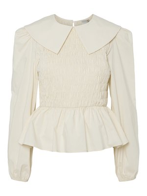 Κρεμ μπλούζα με μεγάλο επίπεδο γιακά, σμιλευμένο σώμα και φουσκωτά μανίκια. Διαθέτει τελείωμα πεπλούμενης μορφής και κλείσιμο στην πλάτη. Φτιαγμένη από ελαφρύ ύφασμα.