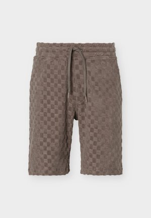 Brune terrycloth-shorts med ternet tekstur, elastik i taljen og justerbar snor foran.