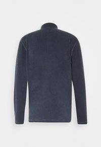 Marinblå långärmad skjorta gjord av mjukt material med hög krage, med en slät yta och enkel design. Inga synliga logotyper eller mönster.