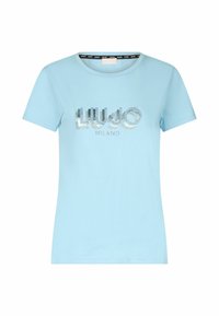 Šviesiai mėlyna trumpomis rankovėmis marškinėliai, pagaminti iš medvilnės, su sidabro spalvos deimantiniu logotipu „Liu Jo Milano“ ant priekinės dalies. Klasikinis apvalios kaklo dizainas.