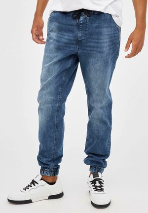 JOGGER CON ROTOS - Vaqueros tapered - azul