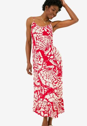 Maxikleid mit rot-weißen Muster, Spaghettiträgern, ausgestelltem Saum und seitlichen Details. Aus leichtem Stoff, ideal für warmes Wetter.