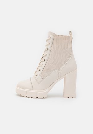 Bottines à talons hauts - white