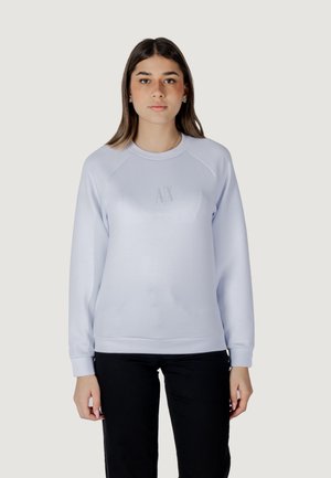 Felpa di colore lilla chiaro con scollatura rotonda e maniche a raglan. Presenta un logo testurizzato al centro. Tessuto morbido, vestibilità comoda.