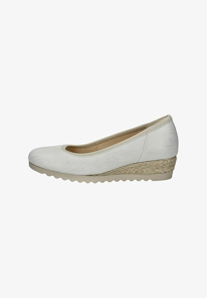White wedge shoes with a textured fabric upper and a woven jute accent at the heel. Rounded toe and a flexible rubber sole.