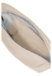 Beige stoffen zakje met een open rits, met een grijze binnenvoering en een gaasvak aan de binnenkant.