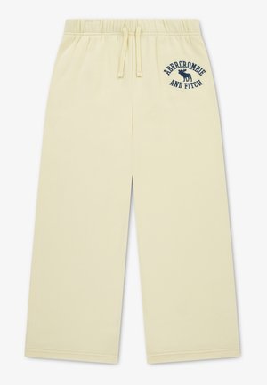 Lysegule bukser med vide ben, elastik i taljen og snøre, med mørkeblå Abercrombie and Fitch-logo på venstre hofte.