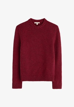 Sarkana adīta džemperis ar apaļu kakla izgriezumu, ribotām malām un piedurknēm. Tekstūrēta auduma ar krāsu pleķiem visā virsmā. Brīvā piegriezumā.
