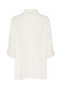 White, short-sleeved shirt with a relaxed fit, collar, and rolled cuffs; lightweight fabric with a subtle texture and back seam detail.
