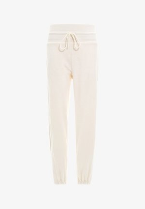 Joggers color crema con vita elastica alta, cordoncino regolabile e polsini aderenti; realizzati in tessuto morbido e testurizzato.