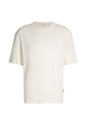 Short-sleeve cream T-shirt made of cotton, featuring a round neck, relaxed fit, and a small logo tag on the side. Smooth texture.