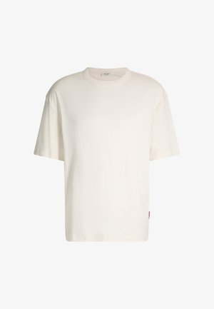 Short-sleeve cream T-shirt made of cotton, featuring a round neck, relaxed fit, and a small logo tag on the side. Smooth texture.
