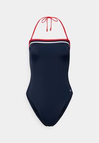 Μπλε ναυτικό ολόσωμο μαγιό με κόκκινους ιμάντες γύρω από τον λαιμό, λευκή λεπτο μέρεια κατά μήκος της γραμμής του ντεκολτέ, ομαλή υφή και ψηλά ανοίγματα στα πόδια.