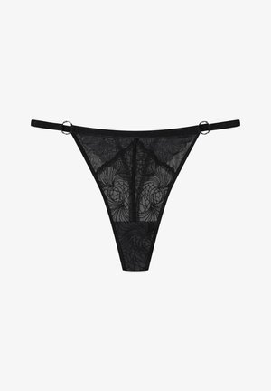 Black lace thong with intricate floral patterns, featuring thin straps and metal accents at the sides. Sheer material with smooth texture.
