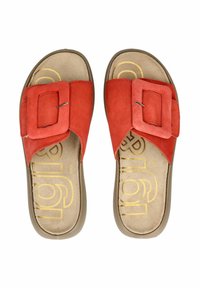 Red suede slide sandals featuring a wide strap with a square buckle, padded footbed, and a textured brown outsole.