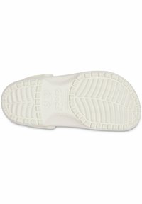 Semelle de chaussure en caoutchouc blanc avec un motif de relief texturé, le nom de la marque "Crocs" imprimé sur le côté, et les marquages de taille visibles.