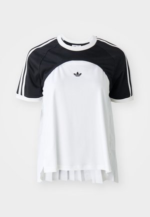 Short-sleeve t-shirt with a black upper and white body, featuring three stripes on shoulders and a pleated lower hem. Adidas logo on chest.