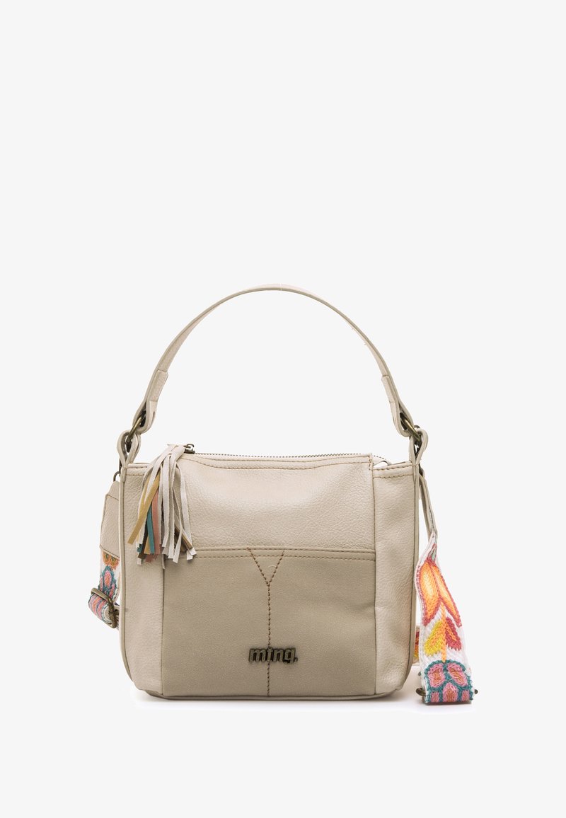Beige Lederhandtasche mit einem strukturierten Design, abnehmbarem, farbenfrohem, besticktem Schultergurt und dekorativen Quasten am Reißverschluss.