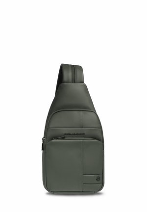 Petit sac bandoulière en cuir vert olive avec poche zippée à l'avant et une bandoulière ajustable.