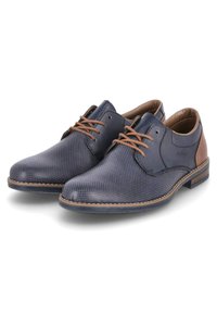 Navy blue perforated leather shoes with brown accents and matching laces, featuring a slightly pointed toe and a contrasting stitched sole.