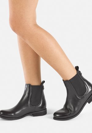 Black leather ankle boots with elastic side panels and rear loops, featuring a rounded toe and low wooden heel. Smooth texture.