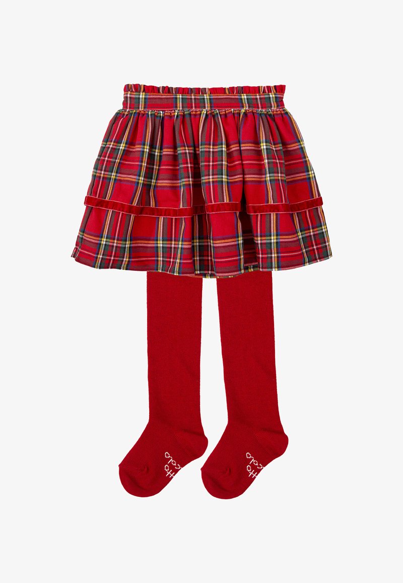 Jupe à carreaux rouges avec taille froncée, dotée de volants et de lignes de couleurs contrastantes, associée à des collants rouges. Tissu doux, design à mi-mollet.