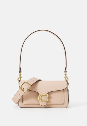 Light pink leather handbag with a curved flap, gold hardware, and a detachable strap featuring a chain accent. Smooth surface and precision stitching.
