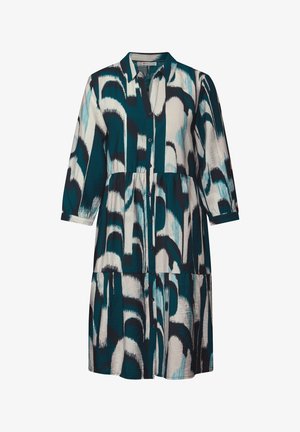 Abito con motivo teal e bianco, colletto, maniche a tre quarti, chiusura a bottoni e design a strati della gonna. Tessuto morbido.