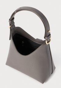 Gray shoulder bag made of structured leather, featuring a rounded top, slim handle, and gold hardware. The interior is lined in black.