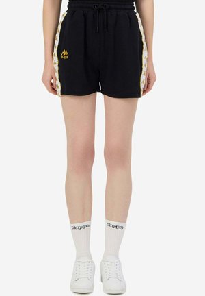 Pantaloni corti neri con vita elastica e cordoncino, caratterizzati da pannelli laterali bianchi con un motivo di logo ripetuto e dettagli dorati.