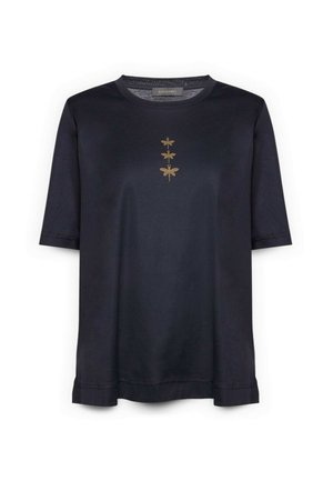 Navyblauw katoenen shirt met korte mouwen, met drie gouden libelle ontwerpen verticaal uitgelijnd in het midden. Zachte textuur, ontspannen pasvorm.